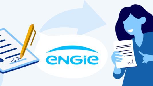 Logo Engie alături de o femeie ce arată spre un contract semnat